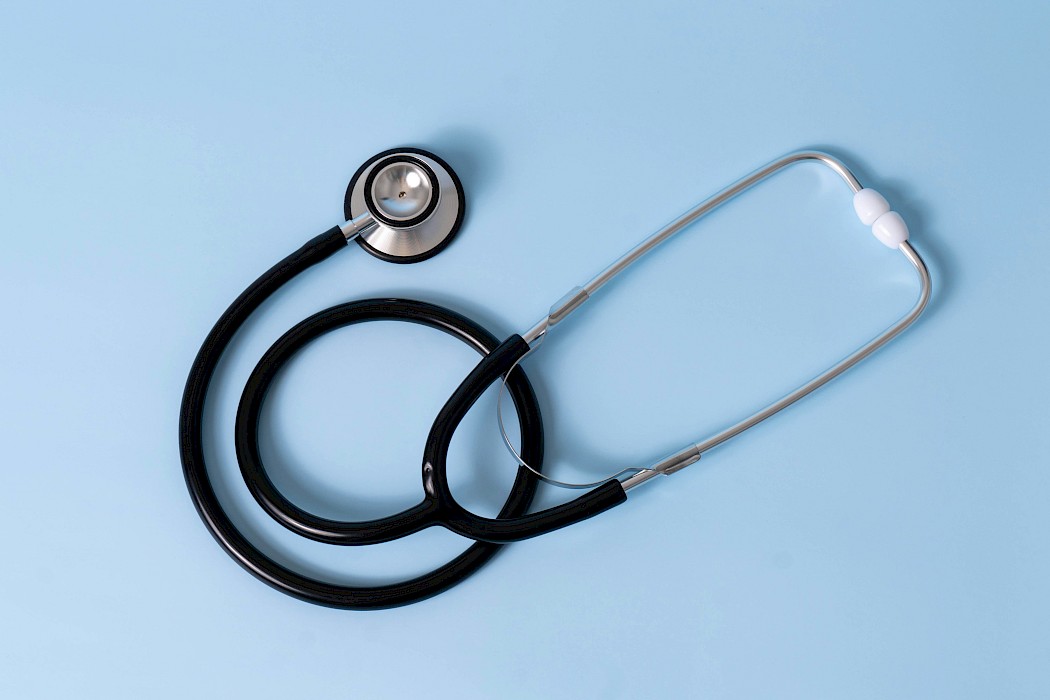 Stethoscope against a blue background.